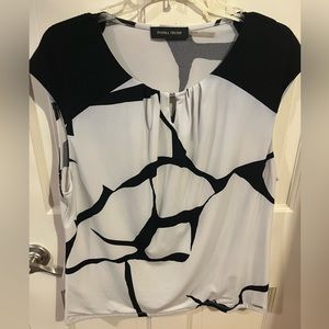 Ivanka Trump cap sleeve black and white top.